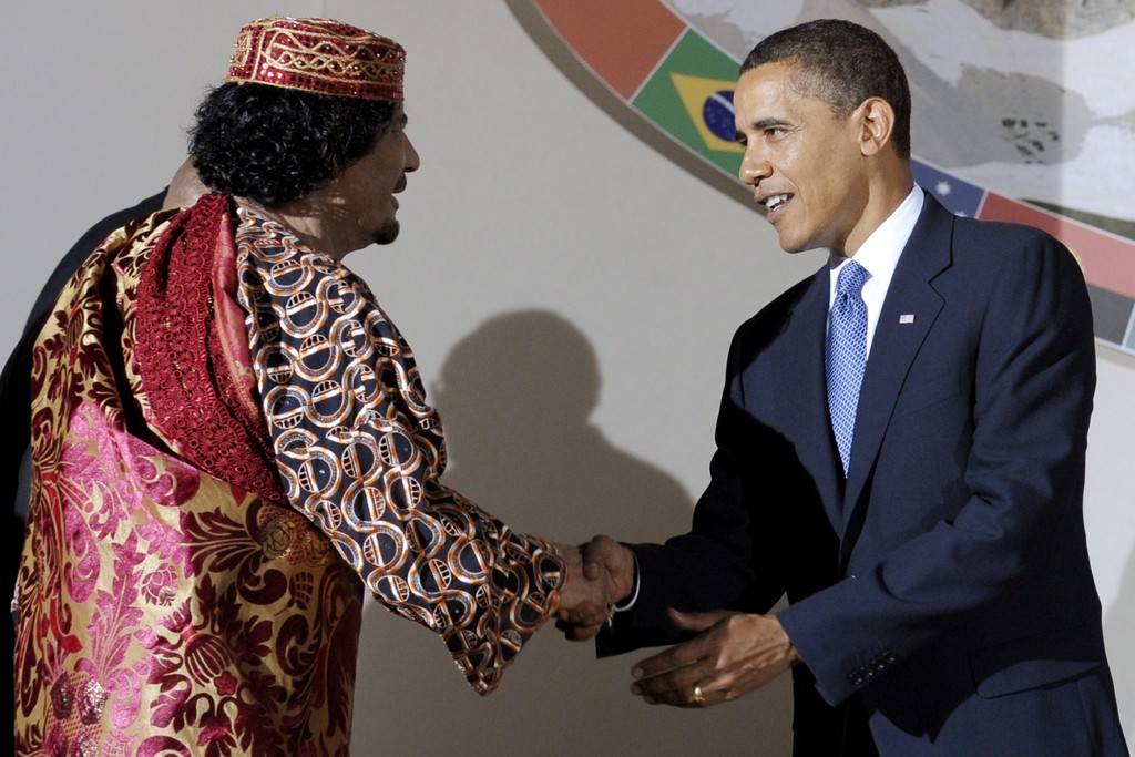 Барак Обама и Муаммар Каддафи